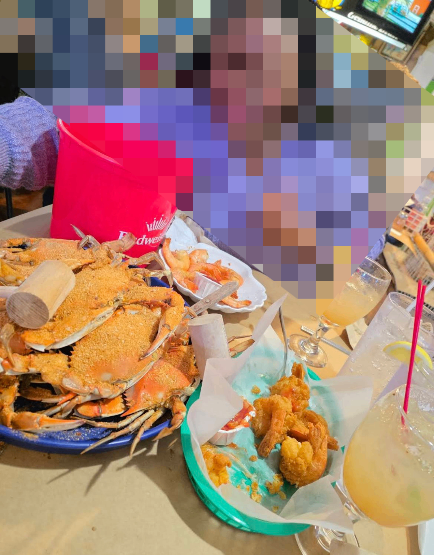 Crab feast spread with steamed blue crabs, fried shrimp and cocktails